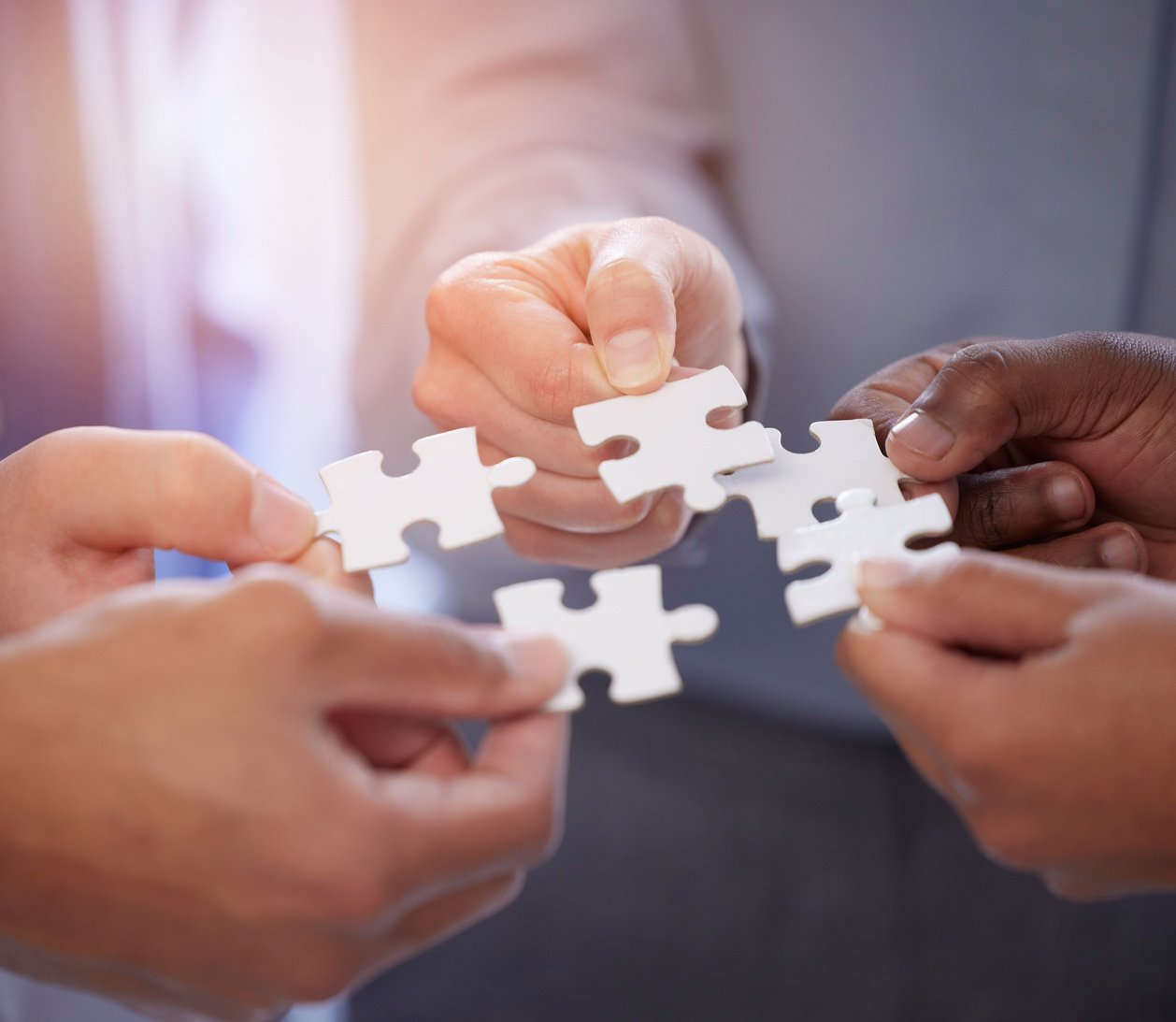 Puzzle, group of people hands for solution, teamwork and workflow goals, achievement and success closeup. Team building game, project development and person problem solving, synergy or collaboration